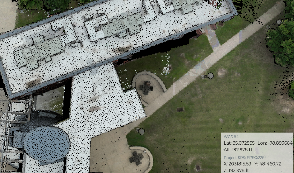 LiDAR point cloud showing a building and adjacent law with an overview of Lat/Long and altitude.